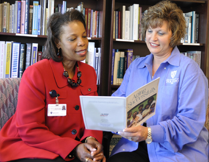 Dr. Barbara Kopp Miller, right, and Dr. Patricia Hogue looked over one of many pamphlets they’ve collaborated on over the years.