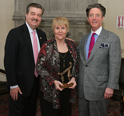 Patricia Rizzi, UT’s annual Jefferson Award Champion, posed for a photo with Greg Moore, national director of the Jefferson Awards for Public Service, left, and UT Vice President Lawrence Burns.