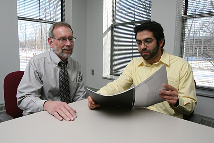 UT junior Hasan Dudar showed his research project to Dr. Larry Connin. Dudar received the first Chaudhary-Steinitz Honors Research Grant for his project that focuses on assisting Pakistan.