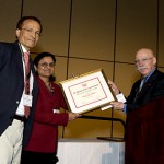 Dr. Bina Joe received the Young Scholar Award from the American Society of Hypertension from the organization’s president, Dr. Henry R. Black. Dr. Nader Abraham, UT professor and chair of the Department of Physiology and Pharmacology, was in New York for the presentation at the society’s annual meeting.