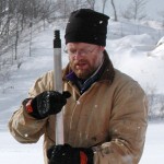 Dr. Timothy Fisher, shown here three years ago with a thrust rod of a corer, which he used to recover 1-meter segments of sediment cores from lake ice on Goshorn Lake, an inland lake next to Lake Michigan south of Holland, Mich., conducted similar research on small lakes around Lake Superior.