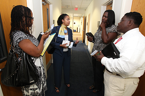 Dr. Shanda Gore, assistant vice president for equity and diversity, speaking in the center, gave a tour of the Minority Business Development Center and showed, from left, Anita Jones, Nychola Richardson and Donald Stinson of the Ohio Department of Administrative Services’ Equal Opportunities Division their new satellite office space.