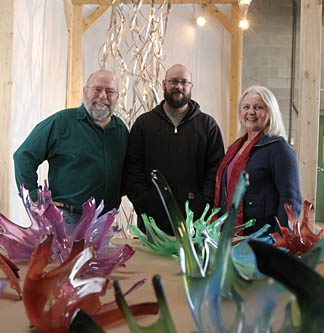 Tom Lingeman, left, Jason Arbogast and Mary Ellen Graham posed for a photo with pieces of their sculpture.