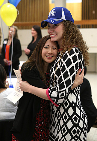 Megan Lawlor, who matched with the University of Kentucky in obstetrics and gynecology, right, hugged Jessica Chang, third-year medical student, during the ceremony.