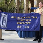 Jim Lapp, president of the UT Retirees Association, left, accepted the banner proclaiming the group as the UT Alumni Association’s Affiliate of the Year from David Dobrzykowski, president of the UT Alumni Association.