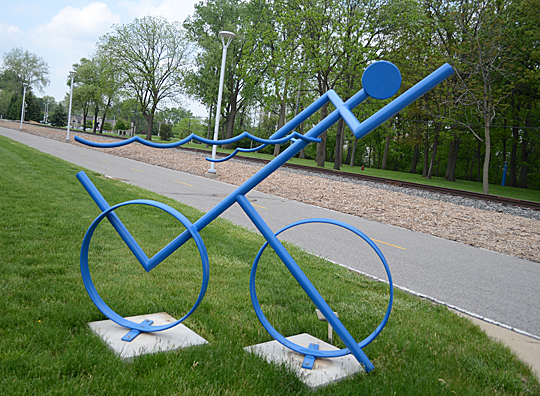 “Iron Man” by Todd Kime races by University Parks Trail north of Ottawa House East and West.