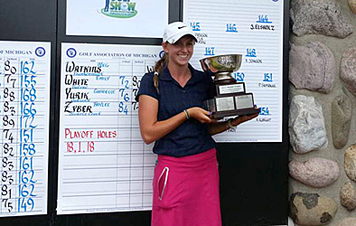 UT senior Jennifer Elsholz holds the trophy for winning the Golf Association of Michigan Women’s Championship.