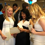 Sonya Naganathan, center, showed her residency placement letter to Chelsea McKirnam, left, and Marla Scott at Match Day. Naganathan will study emergency medicine at Barnes-Jewish Hospital in St. Louis, and McKirnam and Scott will train in obstetrics and gynecology at the University of Kentucky Medical Center in Lexington and Johns Hopkins Hospital in Baltimore, respectively.