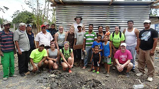 Alex Zmolik, center in back, spent his spring break on a volunteer mission trip in Nicaragua.