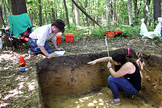 Recent UT graduate Michael Campbell and UT junior Brianna Geer took measurements at the excavation site at Wildwood Preserve Metropark.