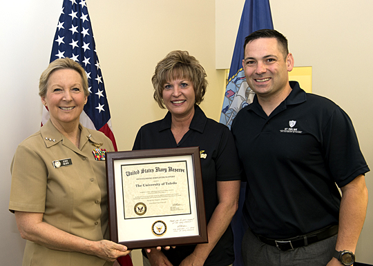 Dr. Barbara Kopp Miller, center, and Navy Reserve Lt. Haraz Ghanbari, on behalf of The University of Toledo, received a Navy Employer Support Certificate of Appreciation from Chief of Navy Reserve Vice Adm. Robin Braun during a ceremony this summer in Norfolk, Va. 