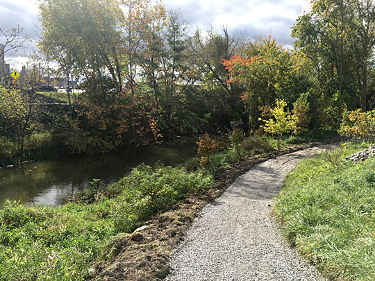 The new gravel path along the Ottawa River starts behind the Law Center and extends to Secor Road.