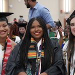 Seniors Shirell White from the Judith Herb College of Education, Jada Alcantara from the College of Pharmacy and Pharmaceutical Sciences and Esperanza Roth from the College of Nursing, from left to right, pose before Thursday evening’s Multicultural Graduation ceremony in Thompson Student Union Auditorium.