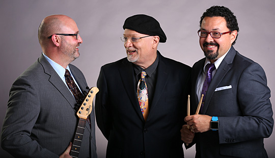 UTrio is Jay Rinsen Weik on guitar, left, Tad Weed on organ, center, and Dr. Olman E. Piedra on drums.