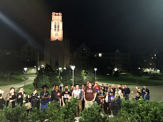 Students gathered Sept. 20 on Centennial Mall for a candlelight vigil to remember Don Reiber, associate professor of communication, who passed away suddenly that morning.
