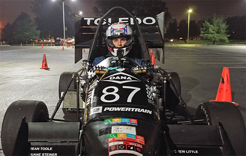 Ben Wolak seated in a racecar as a member of Rocket Motorsports 