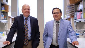 Dr. Juan Jaume, left, and Dr. Shahnawaz Imam, pose in a research lab