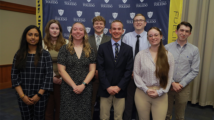 A photo of 8 UToledo students at the Office of Competitive Fellowships' recent Awards Reception and Breakfast honoring faculty and students who were either recently nominated for or have received nationally competitive scholarships and fellowships.