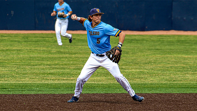 University of Toledo infielder Jeron Williams about to throw the ball during a game.