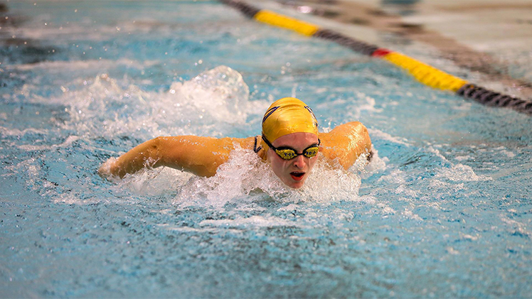 Kennedy Lovell, a senior on UToledo's swimming and diving team, during a swim meet.