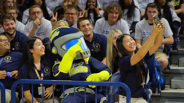 Rocky poses for a selfie with new Rockets during New Student Convocation in Savage Arena.