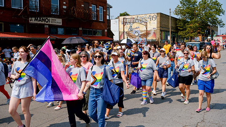 A photo from the front of some of the UToledo contingent marching in the Toledo Pride Parade on Saturday. 