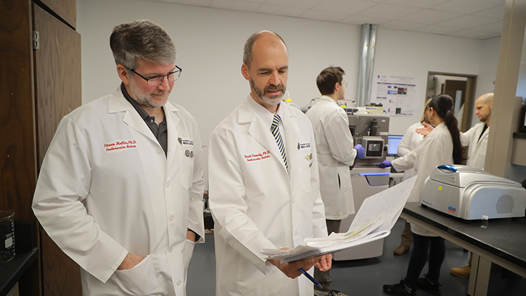 Photo of Dr. Steven Haller, left, and Dr. David Kennedy, both associate professors of medicine at UToledo, are investigating the health effects of additional Great Lakes contaminants including microplastics and forever chemicals.