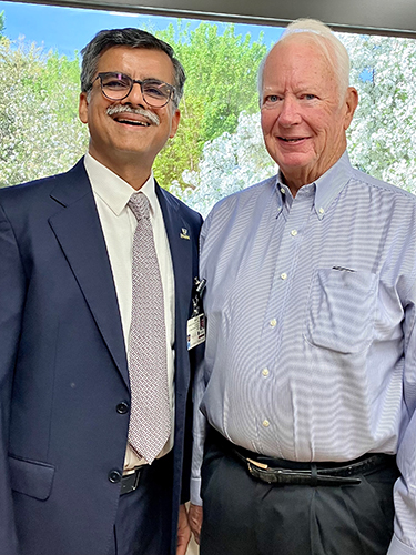 Dr. Puneet Sindhwani, chair of the UTMC Department of Urology, left, with Edward Heinz who underwent successful treatment for prostate cancer.