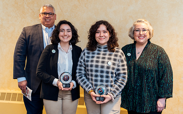 Hala Jabri, center left, and Nadia Jabri, center right, with their stepfather Eddie Campos and mother Jen Campos after receiving the Mental Health & Recovery Services Board of Lucas County's 2023 Teen Leadership Award.