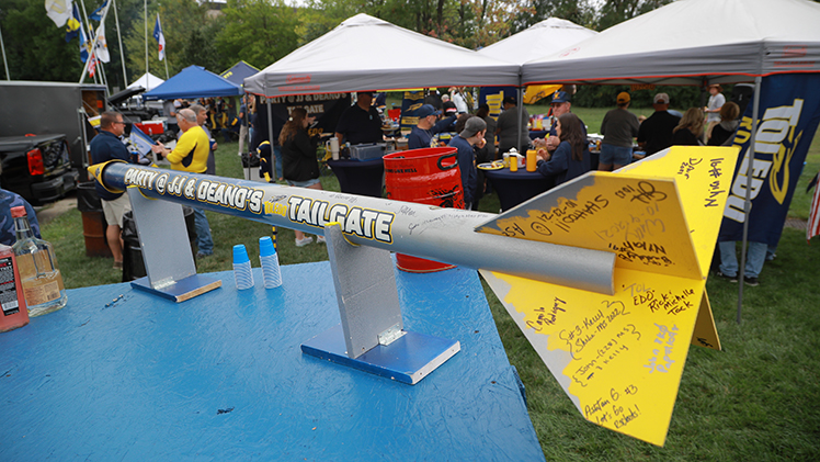 A photo of a model rocket in UToledo colors at the new tailgating location closer to the stadium.