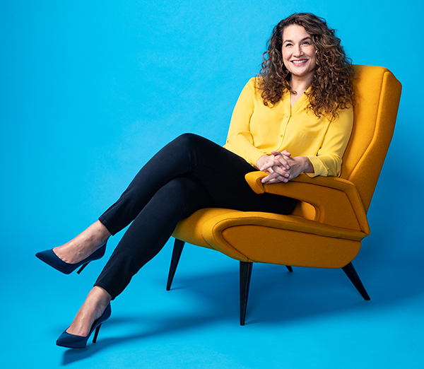 Photo of NPR host Leila Fadel who will present The University of Toledo’s 23rd Annual Maryse and Ramzy Mikhail Memorial Lecture. She is relaxed and sitting in a chair.