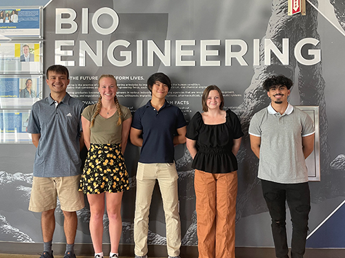 The Sanibag team members are, from left, Luke Sheehan, Kylie Spade (team captain), James Huynh, Meg Taylor and Zein Hassan. pose in front of a a Bioengineering sign.