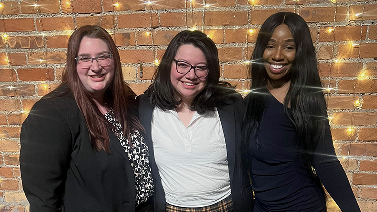 Gabriella Galvan, center in a group photo, is a third-year law student and is president of the Latino Law Student Association. In the photo on either side of her are two other women who are also members of the Latino Law Student Association.