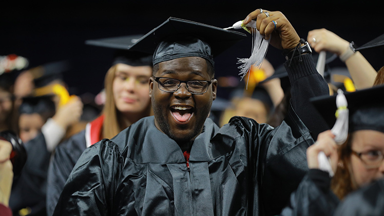 Ja’Sean “Jayy” Smith is all smiles as he moves his tassel after receiving a bachelor’s degree in general studies from the College of Arts and Letters during the morning fall commencement ceremony on Saturday, Dec. 16, in Savage Arena. UToledo celebrated Class of 2023 graduates with two in-person commencement ceremonies.