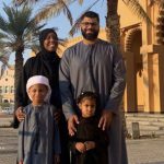 Ashley Jackson and her husband and two children pose for a photo in the United Arab Emirates, where they live.
