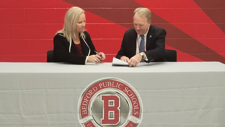 Dr. Gregory Postel, president of UToledo, and Lisa McCaig, president of the Bedford Board of Education, signed an affiliation agreement on Tuesday, Dec. 5, that establishes a path for students to earn college credit hours while still in high school, similar to the College Credit Plus program in Ohio.