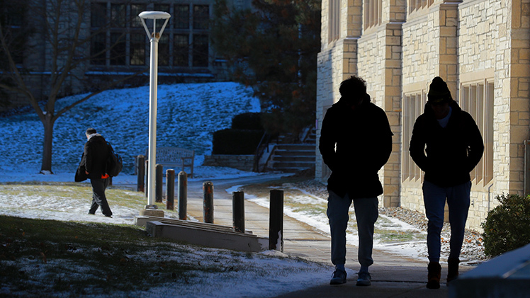 Braden Puckett, a freshman mechanical engineering student, left, and Cole Jondro, a freshman civil engineering student, walk along Main Campus on a bitterly cold Tuesday, as winter greeted UToledo students on the first day of spring semester 2024.  