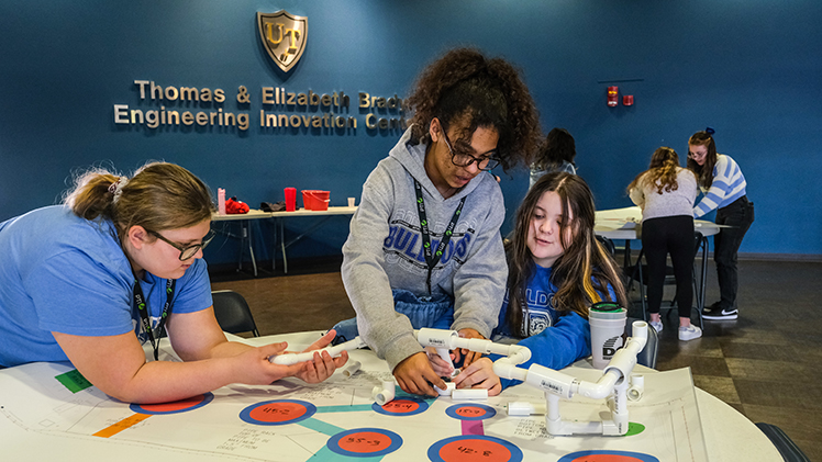 Three middle school girls work together on a project as part of The University of Toledo College of Engineering’s award-winning Introduce a Girl to Engineering Day, which welcomed more than 300 seventh and eighth grade girls from 13 schools to campus on Friday, along with 15 companies.