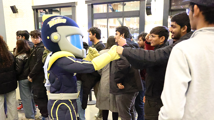 Rocky greets UToledo students during UToledo Night at Detroit Pistons Game on Saturday. 