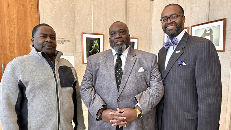 David Young, director of Toledo Excel and Special Projects, center, poses with his brother, Nathaniel J. Young, left, a retired educator, and John C. Jones, president of HOPE Toledo.