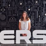 Elise Essenmacher, a junior mechanical engineering student, poses in front of a Fersa sign at the company's headquarters in Zaragoza, Spain. 
