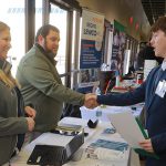 Tyler Kocsis, a mechanical engineering senior, shakes hands after his interview with automotive supplier Auria at the College of Engineering’s Spring Career Expo in Savage Arena.