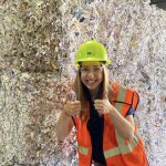 Photo of UToledo business student Rachel Stapleton giving thumbs-up while at her internship at Waste Management Inc.