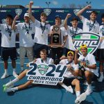 The Toledo men's tennis team celebrates after defeating Western Michigan 4-1 in the championship match of the 2024 Mid-American Conference Tournament in front of a large home crowd at the UT Varsity Tennis Courts on Sunday afternoon to claim its second consecutive tournament crown.