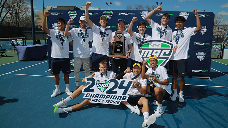 The Toledo men's tennis team celebrates after defeating Western Michigan 4-1 in the championship match of the 2024 Mid-American Conference Tournament in front of a large home crowd at the UT Varsity Tennis Courts on Sunday afternoon to claim its second consecutive tournament crown.