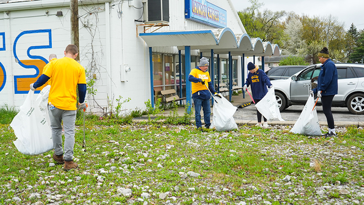 Nearly 100 student-athletes, coaches and staff from the UToledo Athletic Department lent a helping hand to the community on April 19 by volunteering their time with Keep Toledo/Lucas County Beautiful to help clean up six locations throughout the city of Toledo.