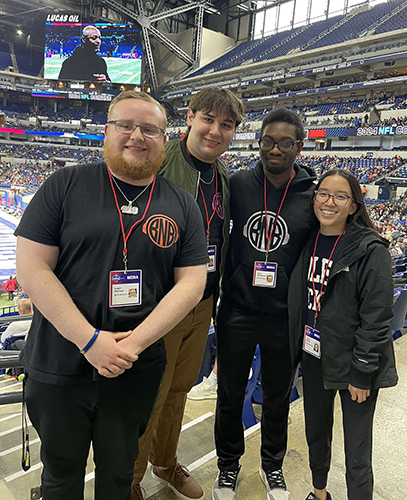 Communication undergraduates Logan McCrory, Christian Dimo, Allen Woodson III and Annie Gouin attend the NFL Combine in Indianapolis. The students obtained press credentials through the student-run radio station 88.3 FM WXUT Toledo.