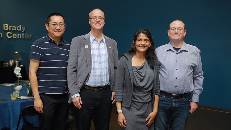 From left, Dr. Zhaoning Song, Dr. Randy Ellington, Dr. Rupali Chandler and Dr. Nik Podraza, all Creative and Scholarly Activity award winners from the Department of Physics and Astronomy.