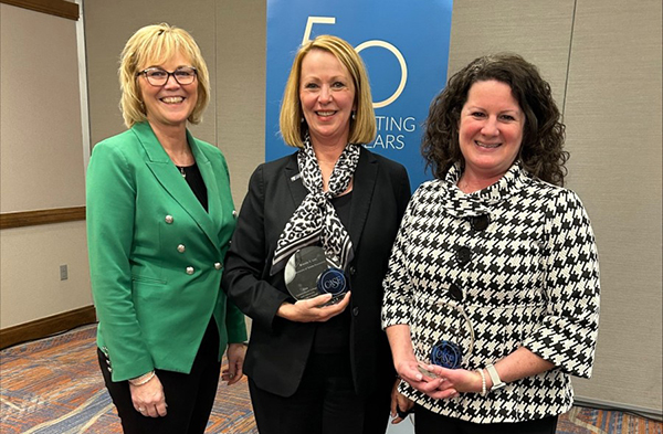 Brenda Lee, center, president of The University of Toledo Foundation, holds her 2024 CASE Commonfund College and University Foundation Award, with fellow award winner, Christy Devocelle, right, chief operating officer and chief financial officer of the University of Illinois Foundation, and College and University Foundation Conference Chair DeAnna Carlson Zink from the University of North Dakota Foundation.