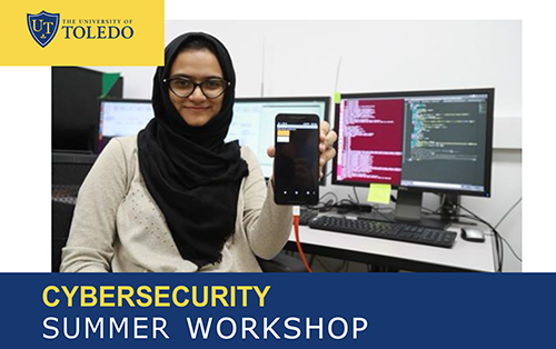 A woman at a desk holds her cell phone that is connected to a computer. The words Cybersecurity Summer Workshop and the UToledo logo are on the image.